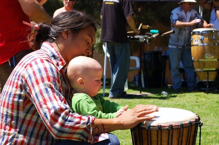 Man and Baby Playing Drum